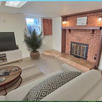 The basement is completely finished with a half bath and second fireplace.